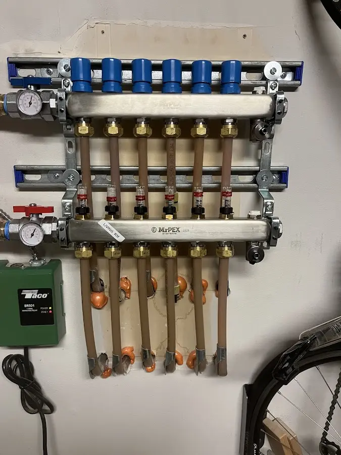 Plumber performing Water Heater Repair at a residential property in Airmont